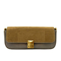 Two-tone handbag with gold clasp on a white background