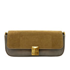 Two-tone handbag with gold clasp on a white background