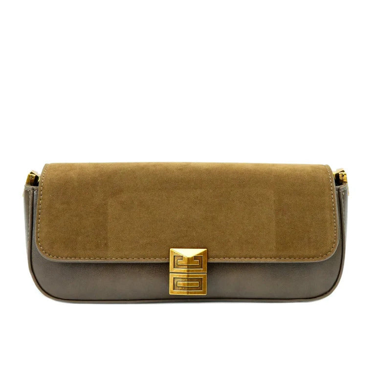 Two-tone handbag with gold clasp on a white background