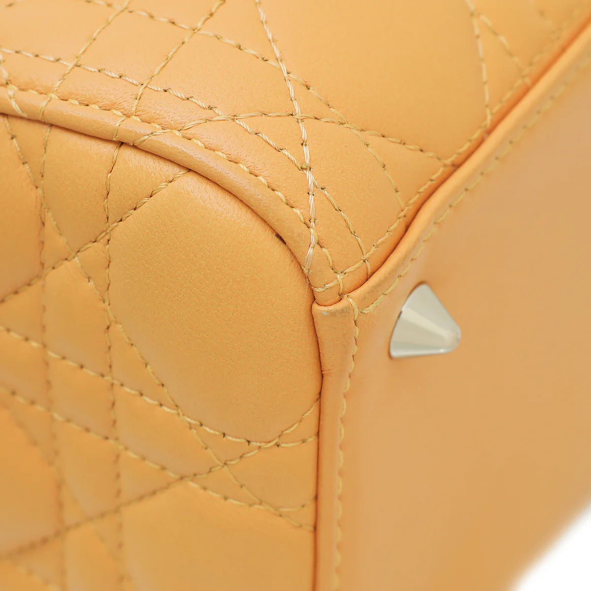 Detail view of hardware on Dior Medium Lady Dior Bag in Coffee Brown