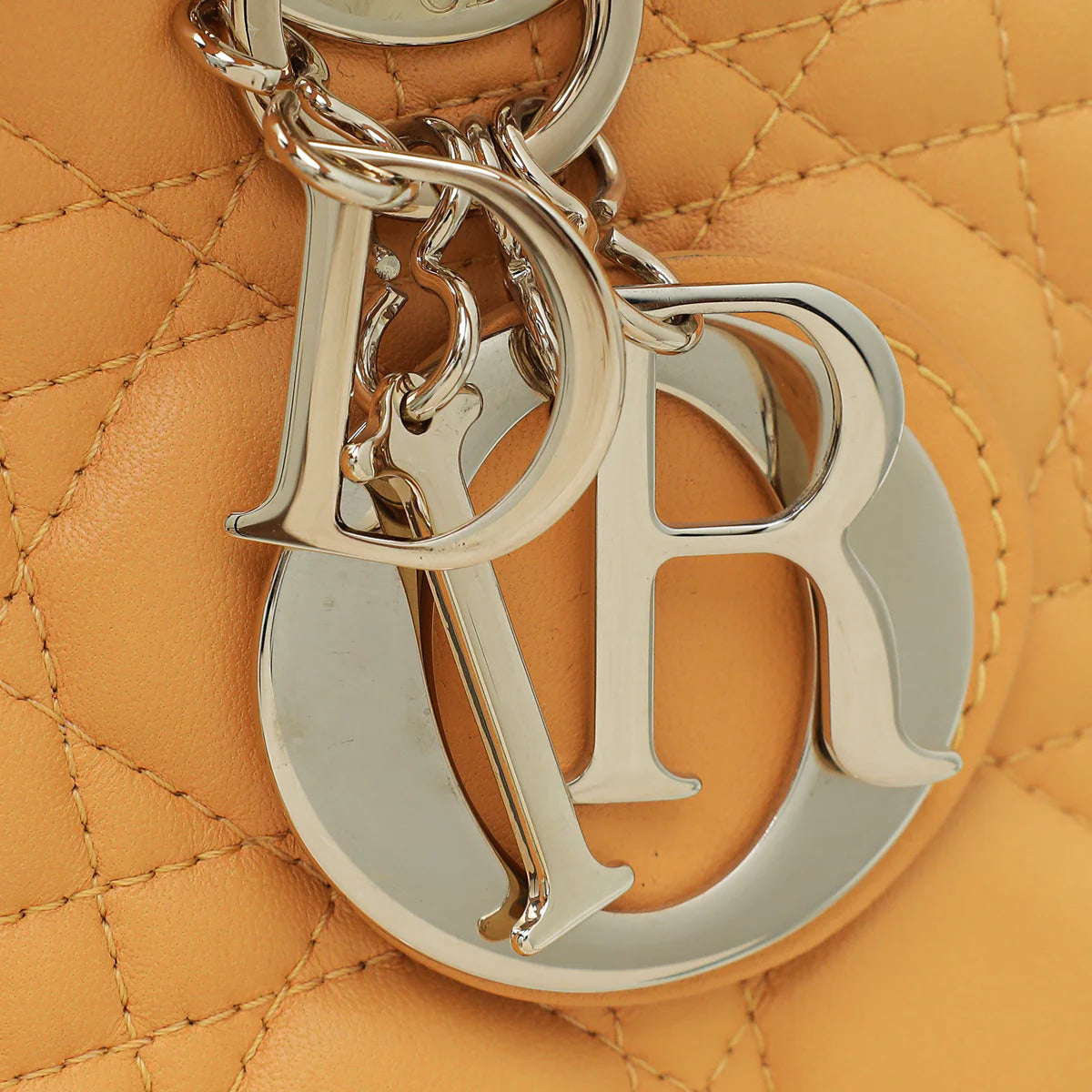 Detail view of shoulder strap on Dior Medium Lady Dior Bag in Coffee Brown
