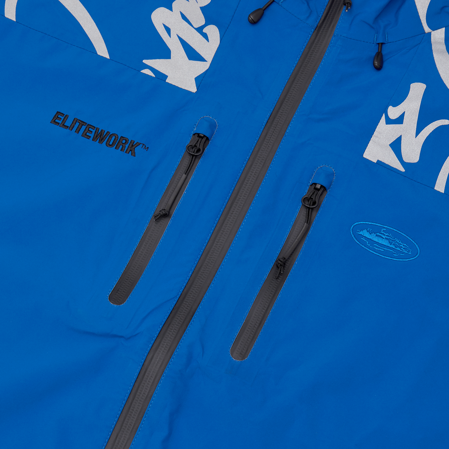 Corteiz Blue Nylon Elitework Waterproof Shell Jacket, side view showing zip pocket detail