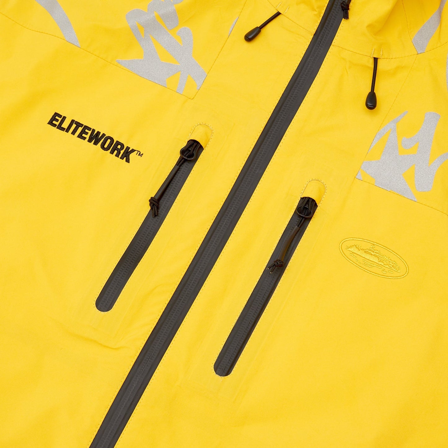 Corteiz Yellow Nylon Elitework Waterproof Shell Jacket, close-up of waterproof zipper and taped seams