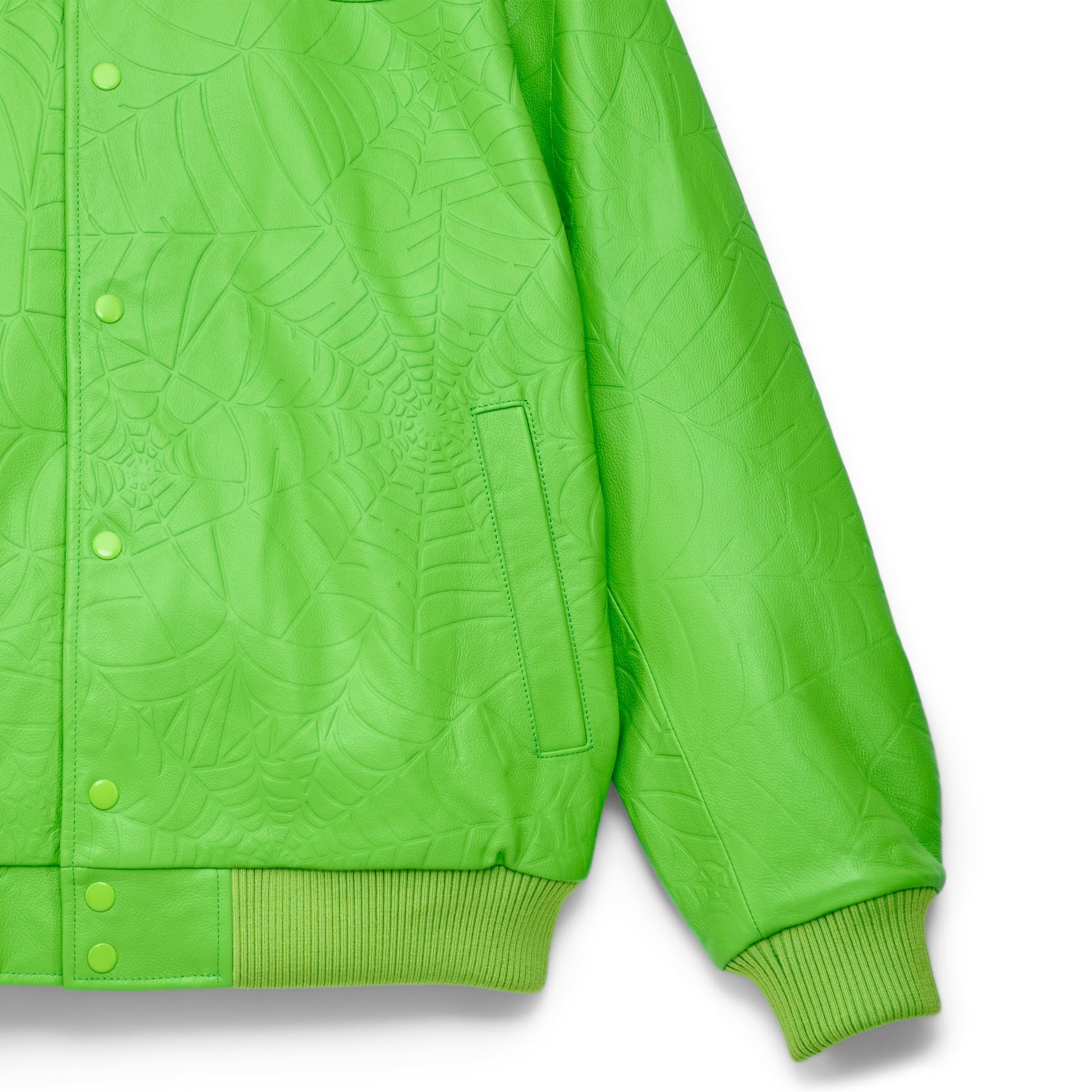 Detail view of debossed web design on SP5DER Debossed Web Leather Jacket in Green