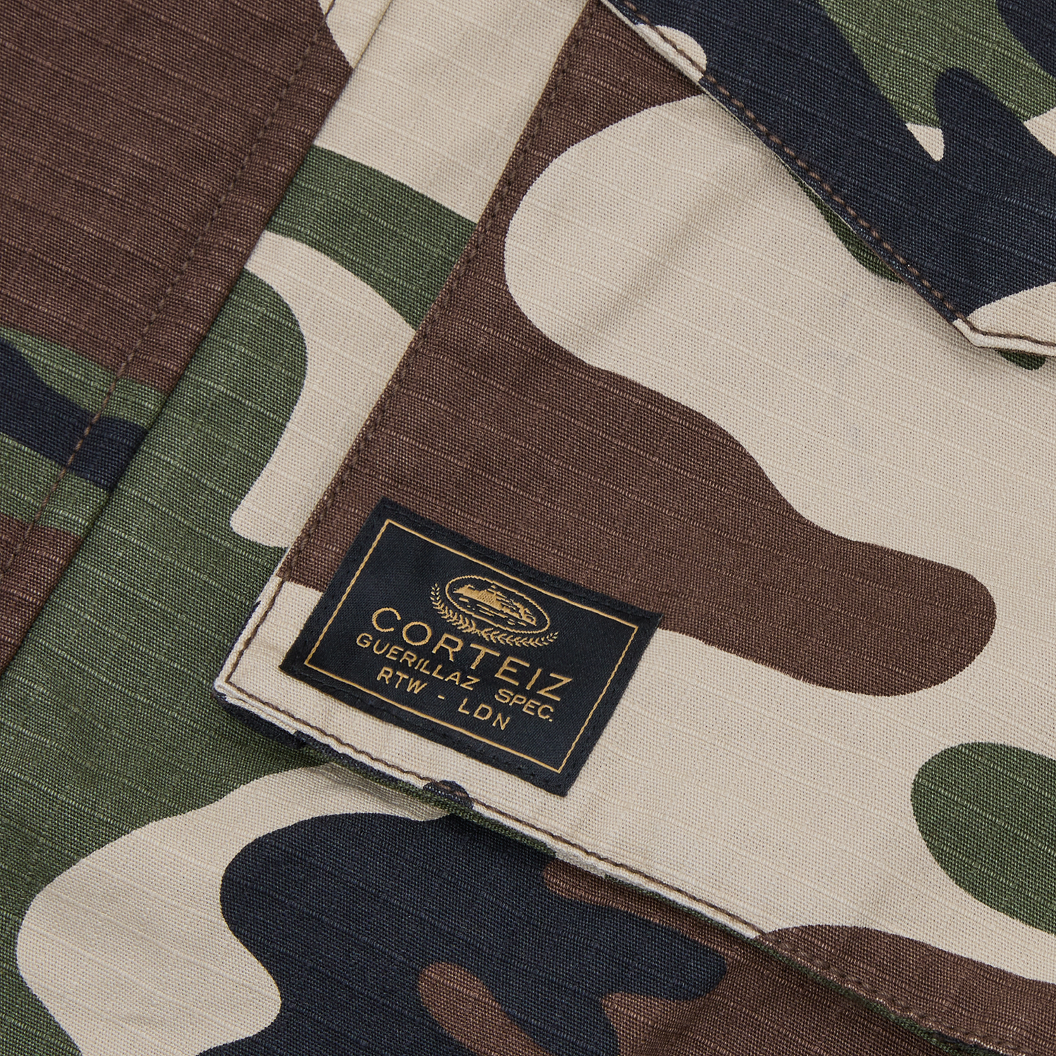 Corteiz Green Cotton Ripstop Guerillaz Field Jacket, Woodland Camo, close-up of snap cuff adjuster