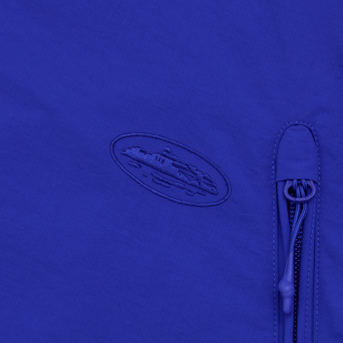 Corteiz Blue Nylon Litework Quattro Jacket, Royal Blue, close-up of tonal chest embroidery