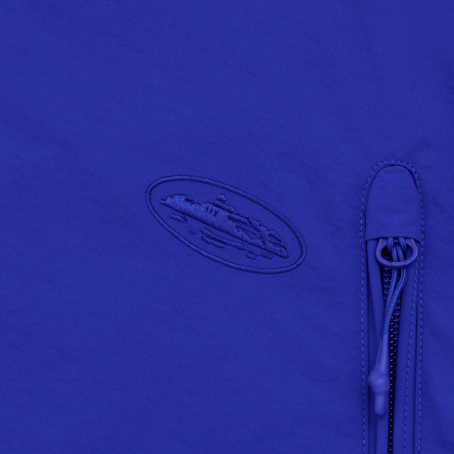 Corteiz Blue Nylon Litework Quattro Jacket, Royal Blue, close-up of tonal chest embroidery
