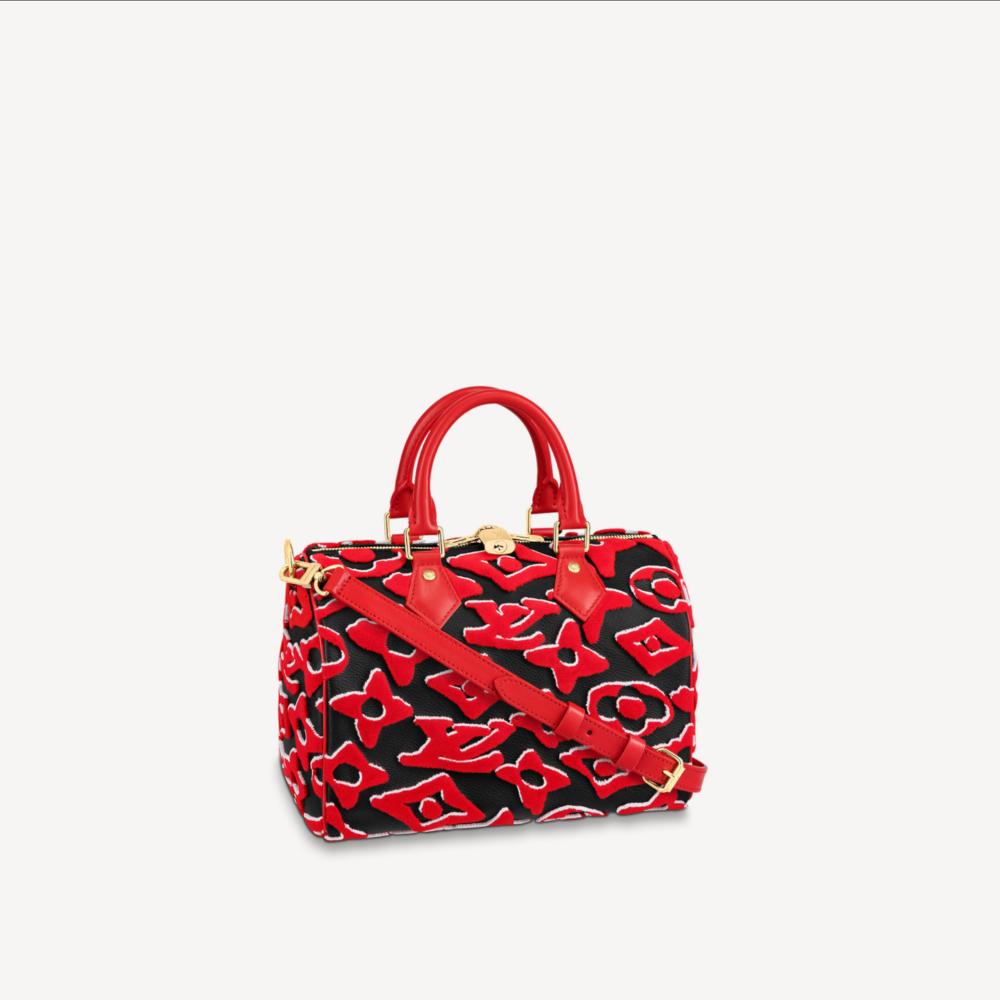 Red and black patterned handbag on a white background