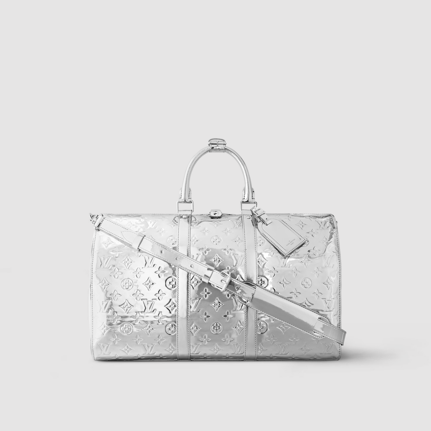 Silver handbag with reflective pattern on a light gray background