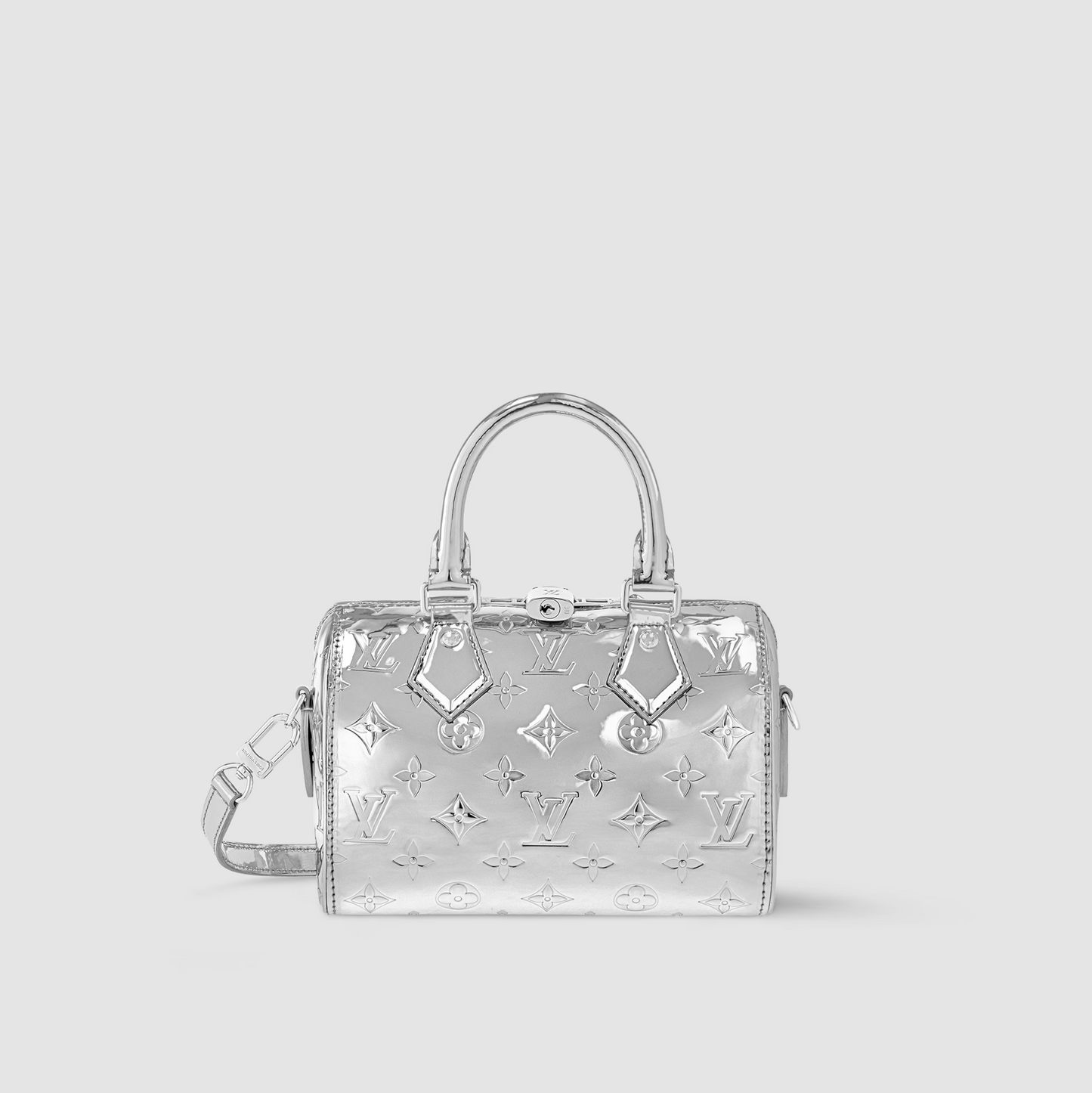 Silver handbag with reflective monogram pattern on a light gray background