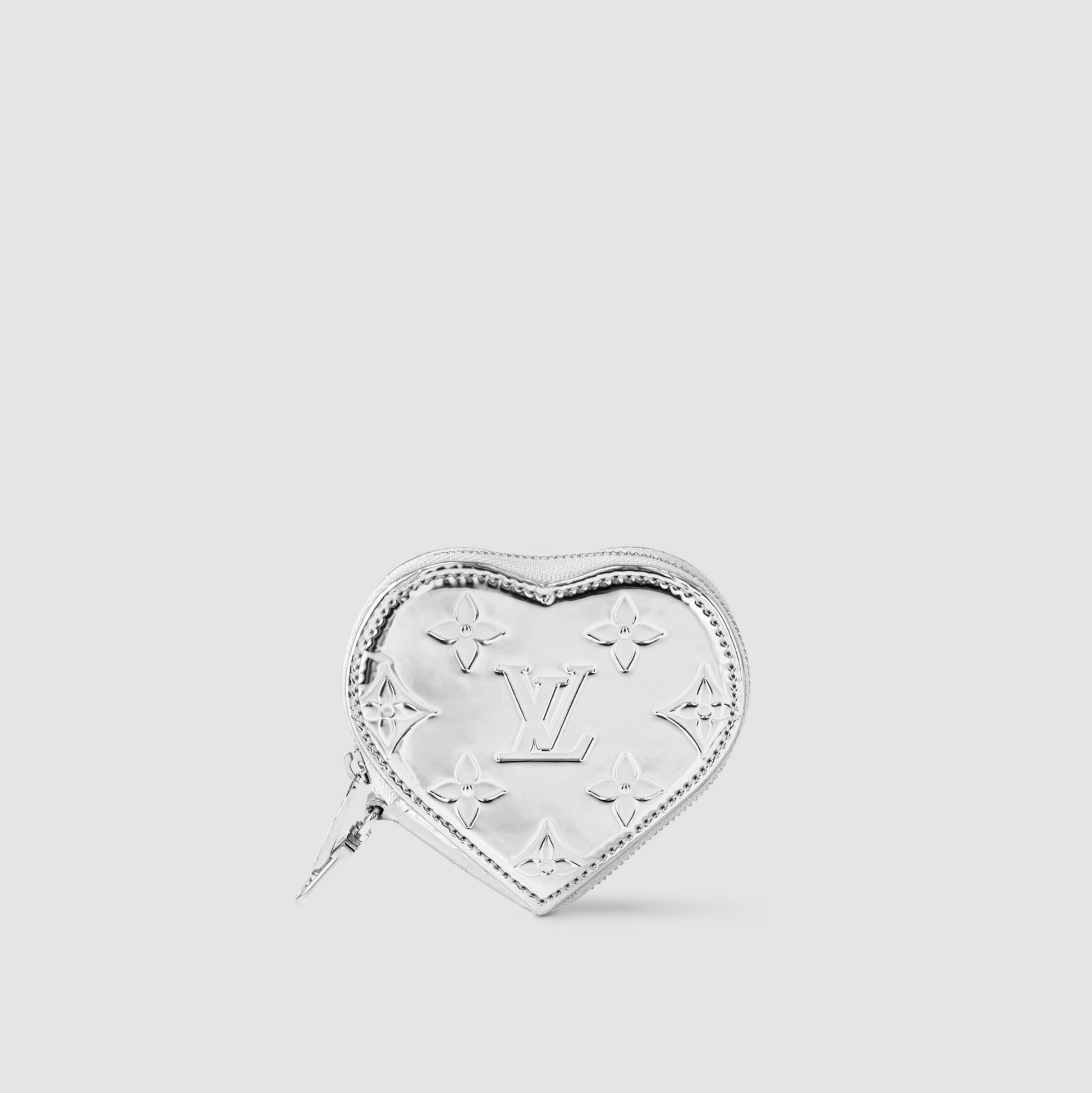 Heart-shaped silver pouch with Louis Vuitton logo on a light gray background