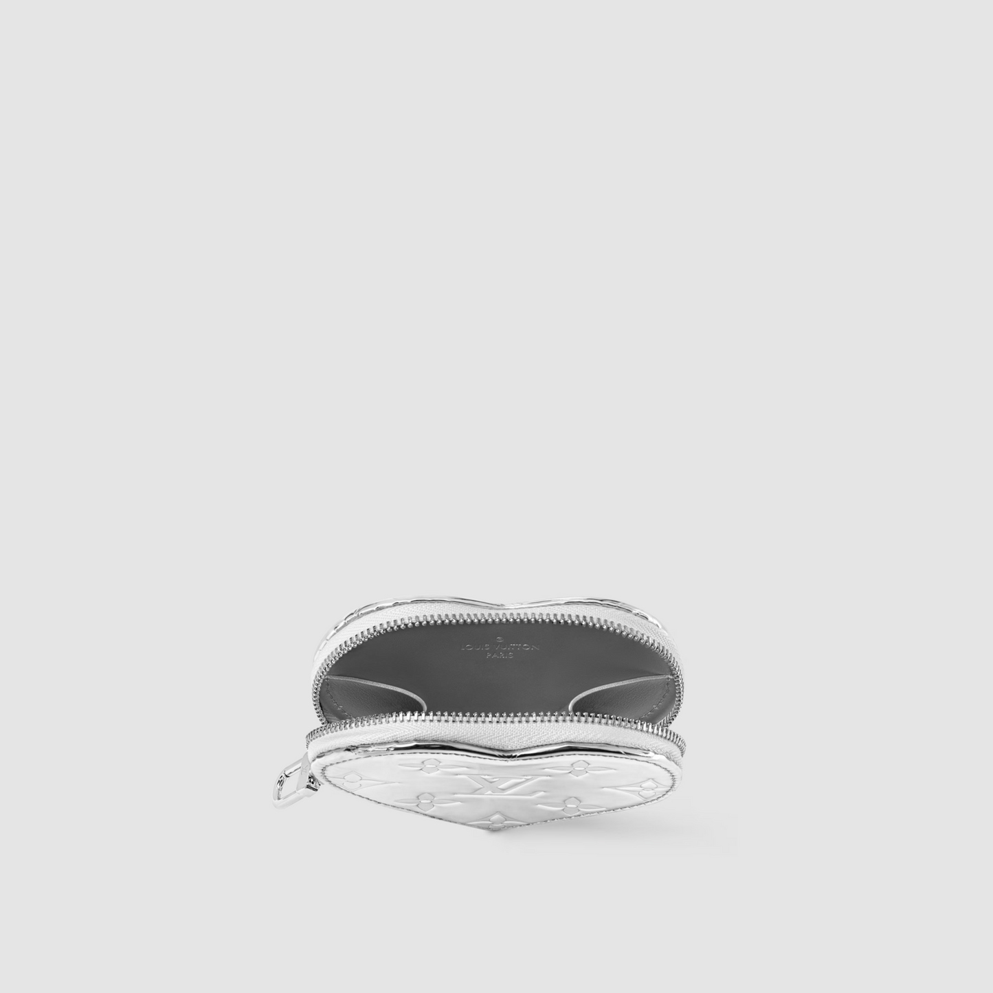 Silver ring with a textured band on a light gray background