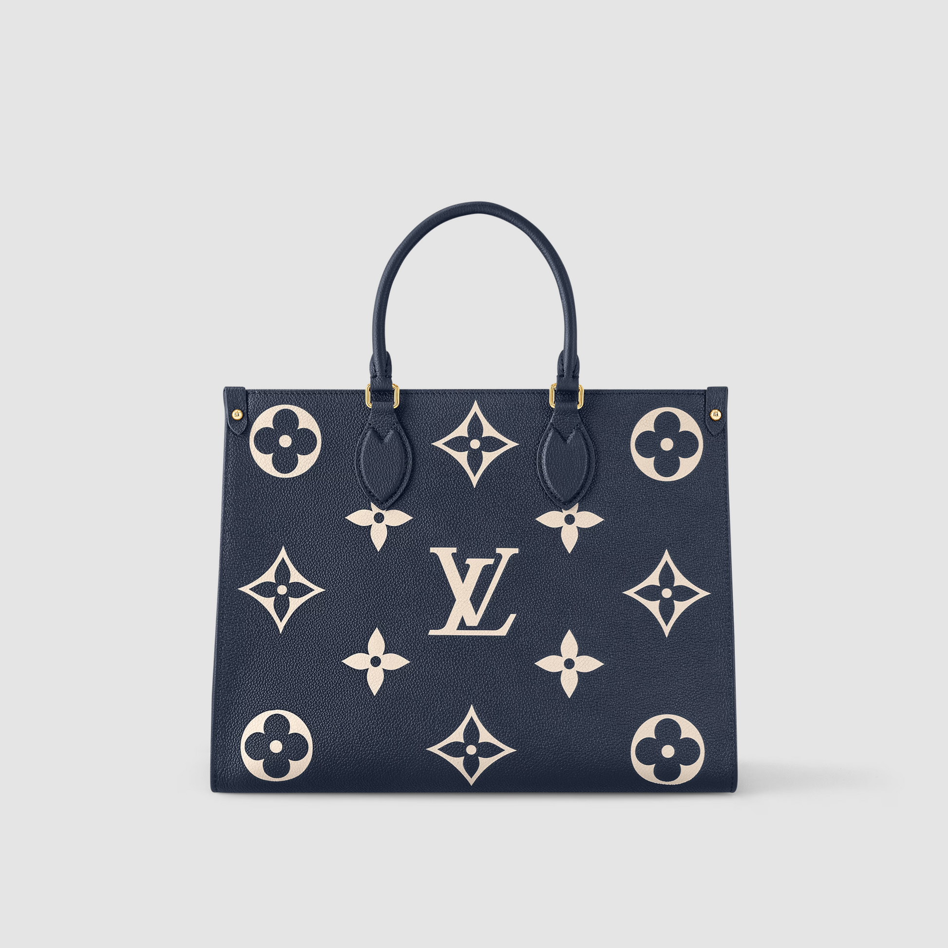 Designer handbag with monogram pattern on a light gray background