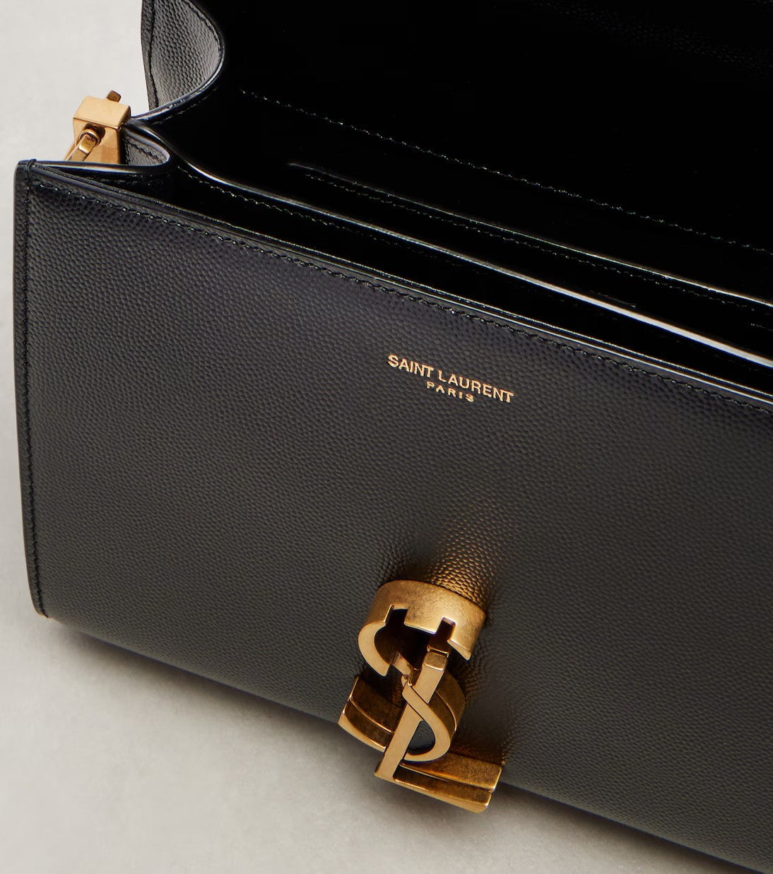 Saint Laurent Cassandra Mini bag in Black - detail view of turn-lock hardware