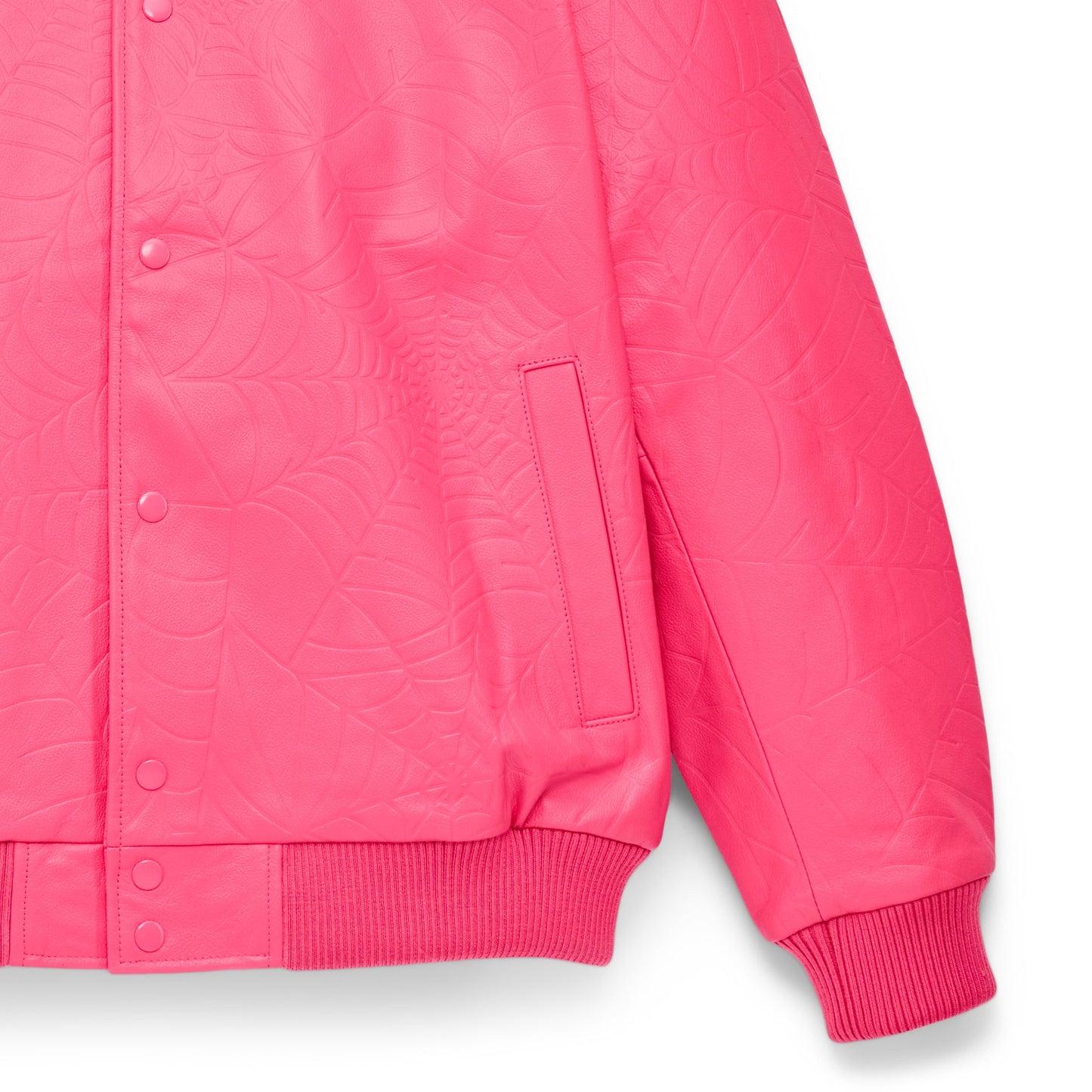 Detail view of debossed web design on SP5DER Debossed Web Leather Jacket in Pink