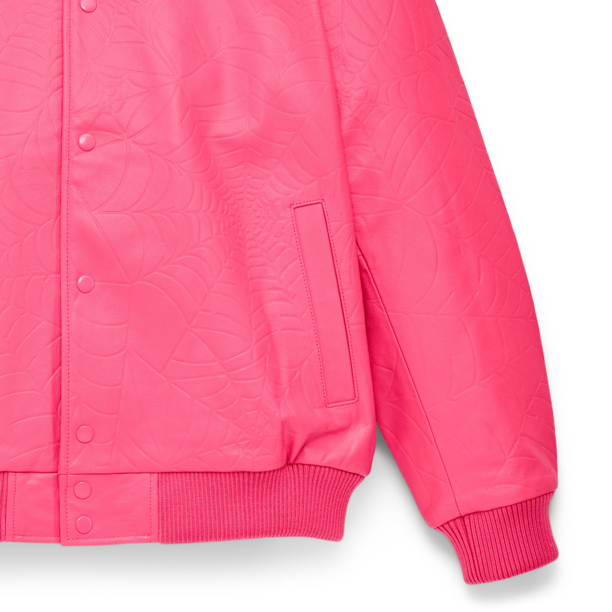 Detail view of debossed web design on SP5DER Debossed Web Leather Jacket in Pink