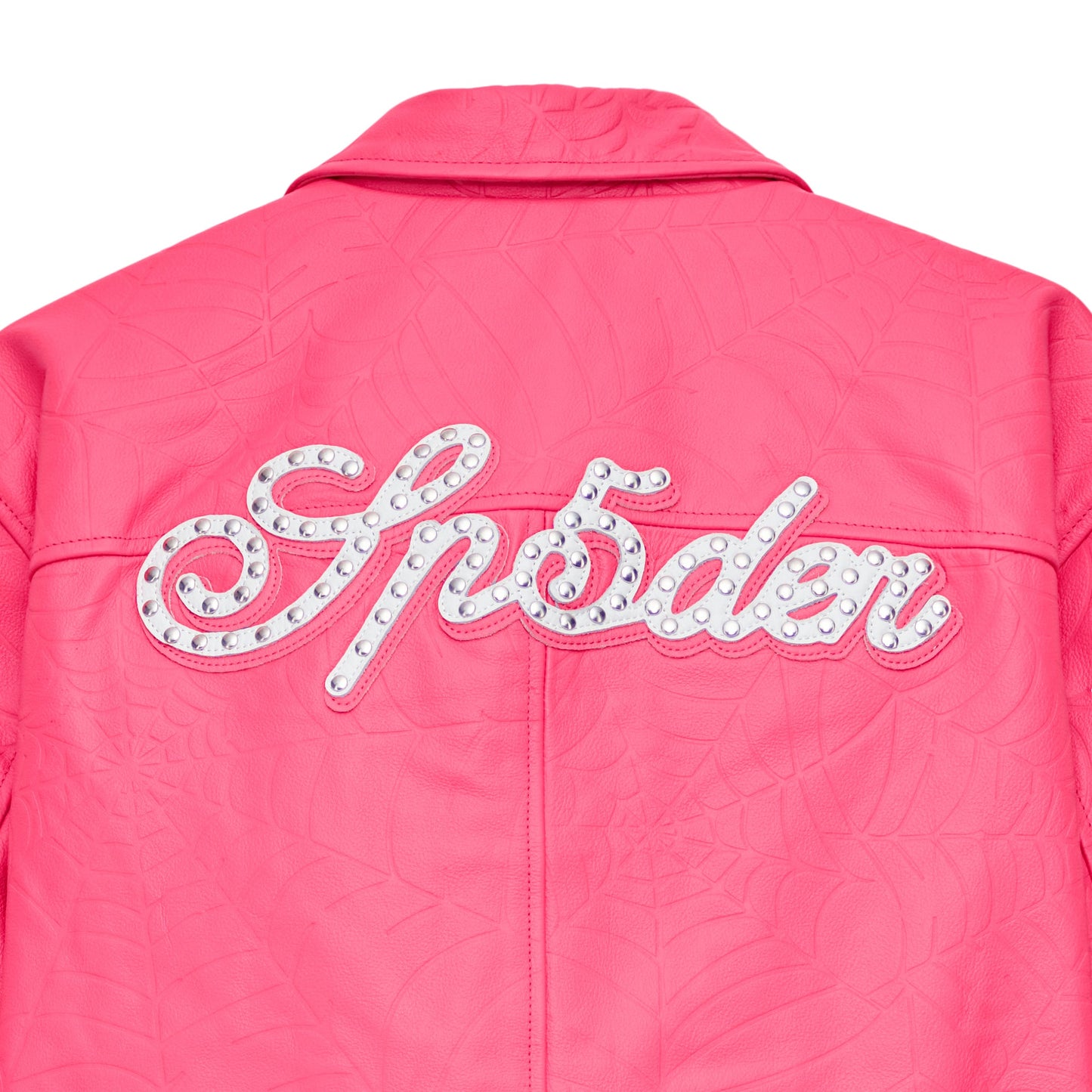 Detail view of studded text on SP5DER Debossed Web Leather Jacket in Pink