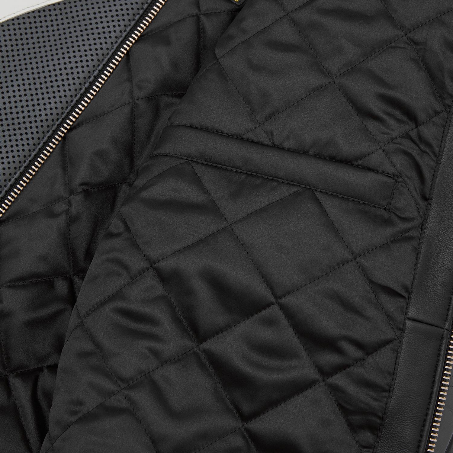 Corteiz Black Leather Skydive Velocity Racing Jacket, close-up of leather texture and stitching detail