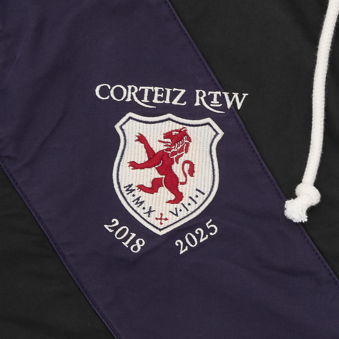 Corteiz Black Cotton Poly Shield Crest Twill Jacket, close-up of patch pocket on left shoulder
