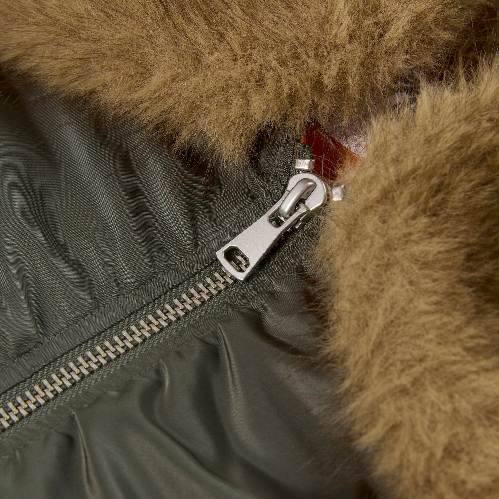 Detail view of embroidered graphic on SP5DER Flight Jacket in Army Green