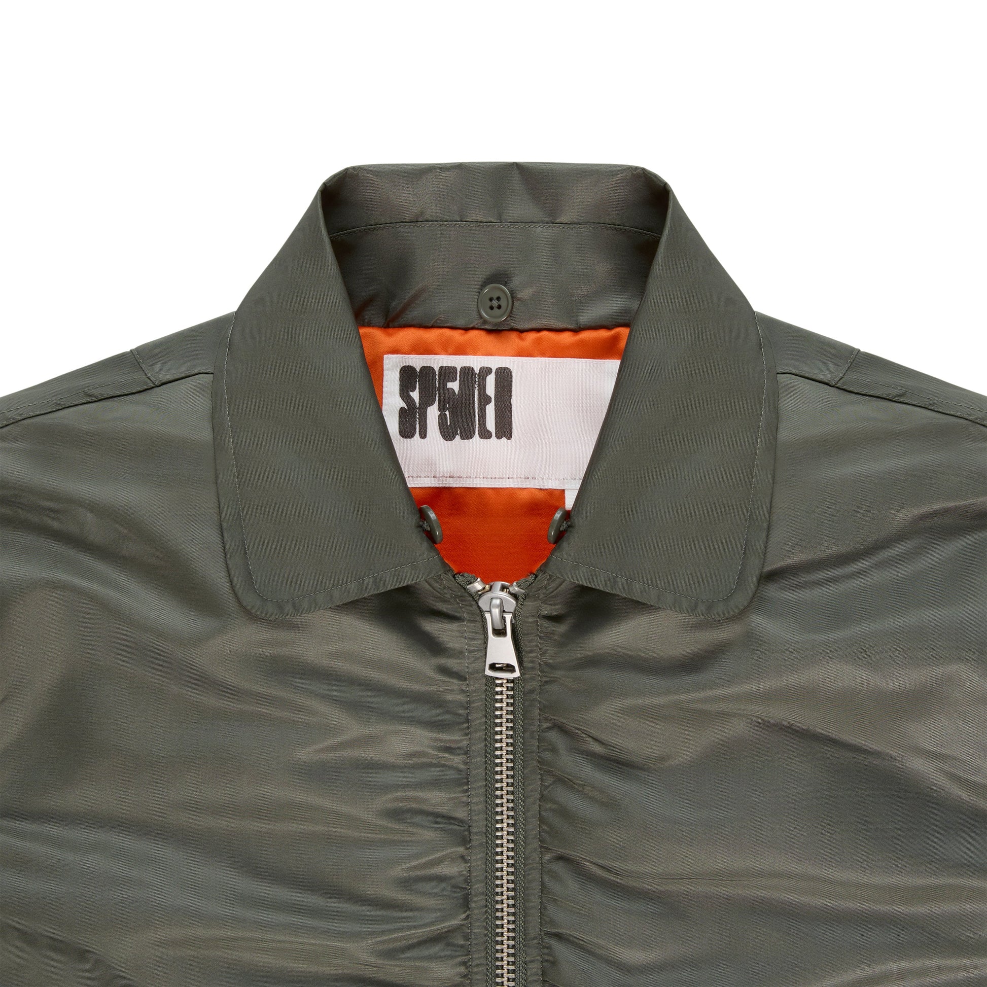 Detail view of snap-button flap pockets on SP5DER Flight Jacket in Army Green