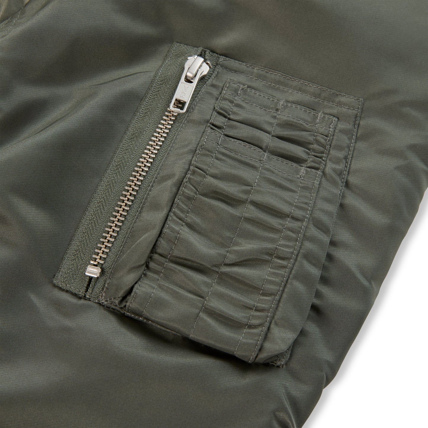 Detail view of utility sleeve pocket on SP5DER Flight Jacket in Army Green