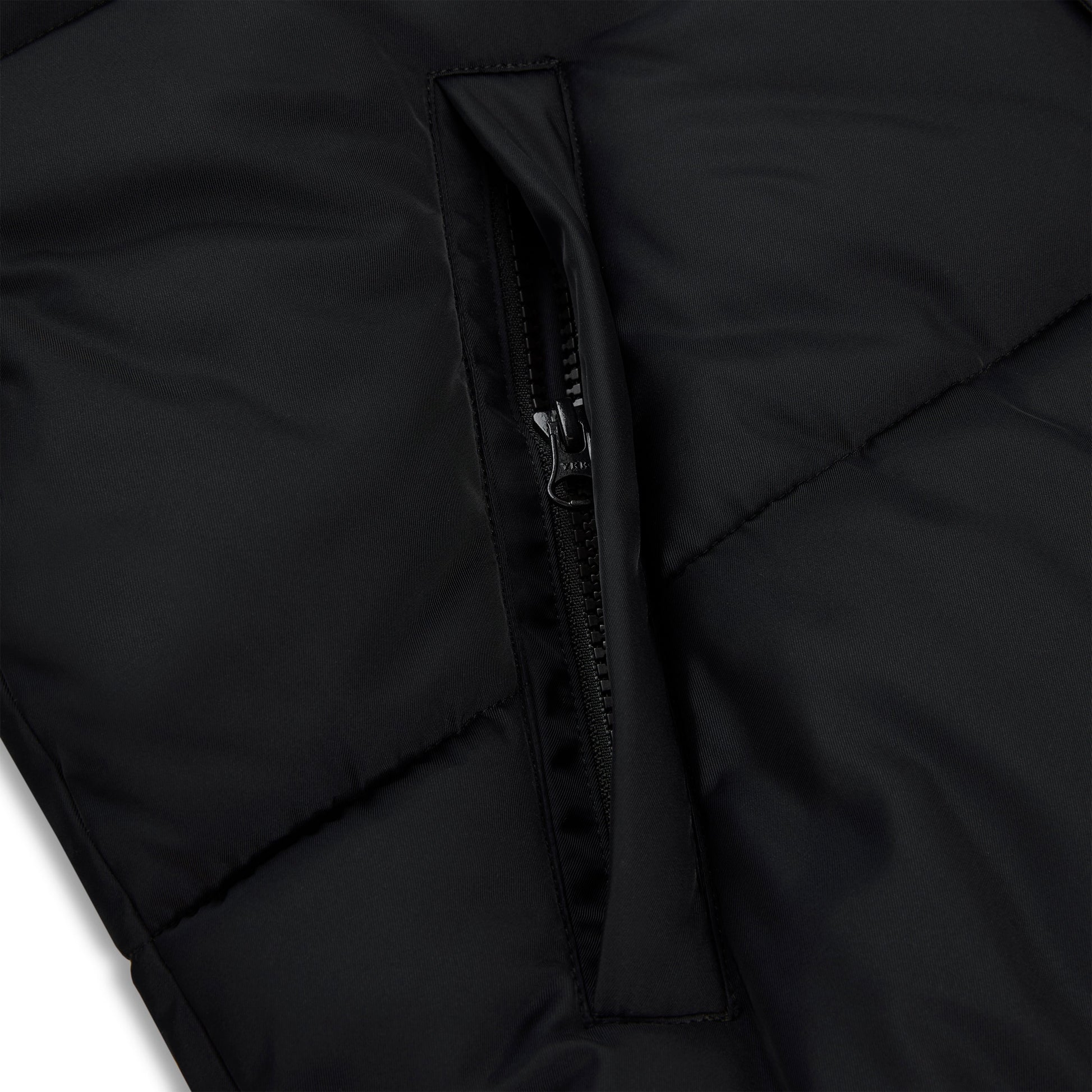 Detail view of side pockets on SP5DER Trackhawk Puffer Jacket in Black