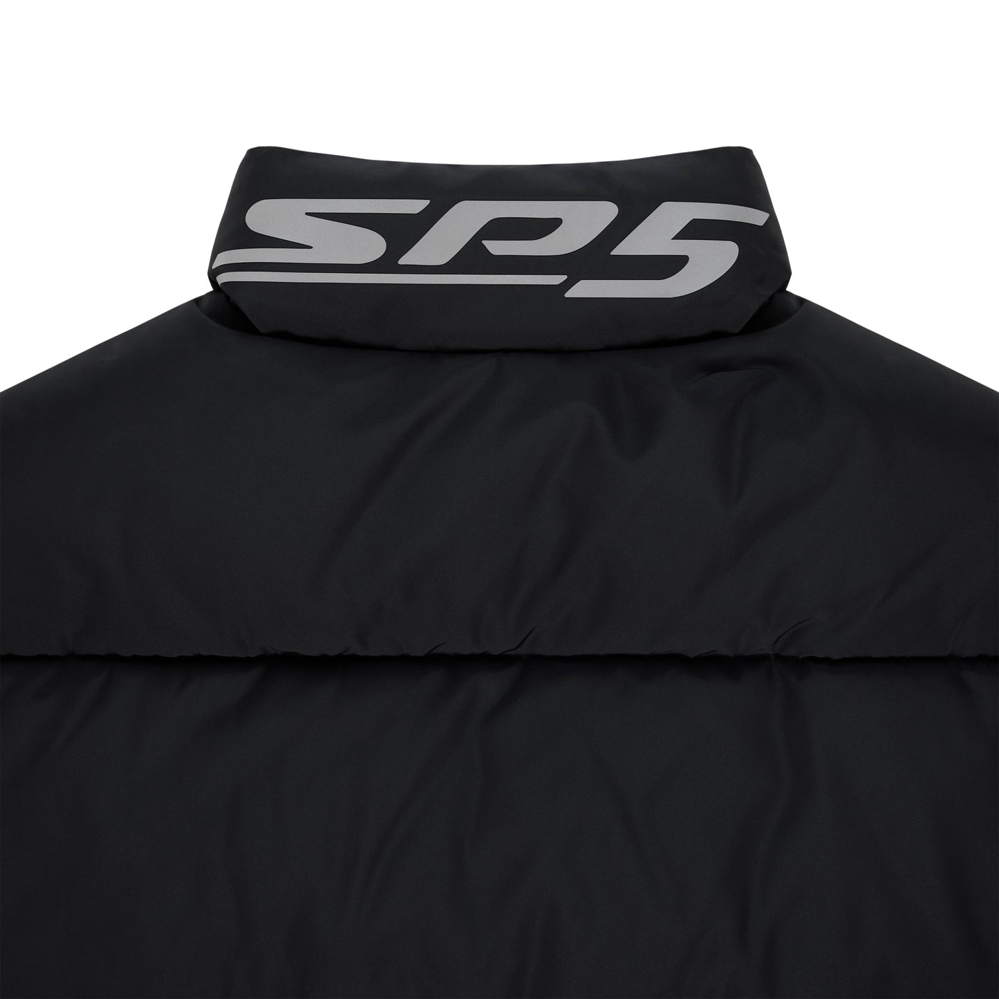 Detail view of internal drawstring hem on SP5DER Trackhawk Puffer Jacket in Black