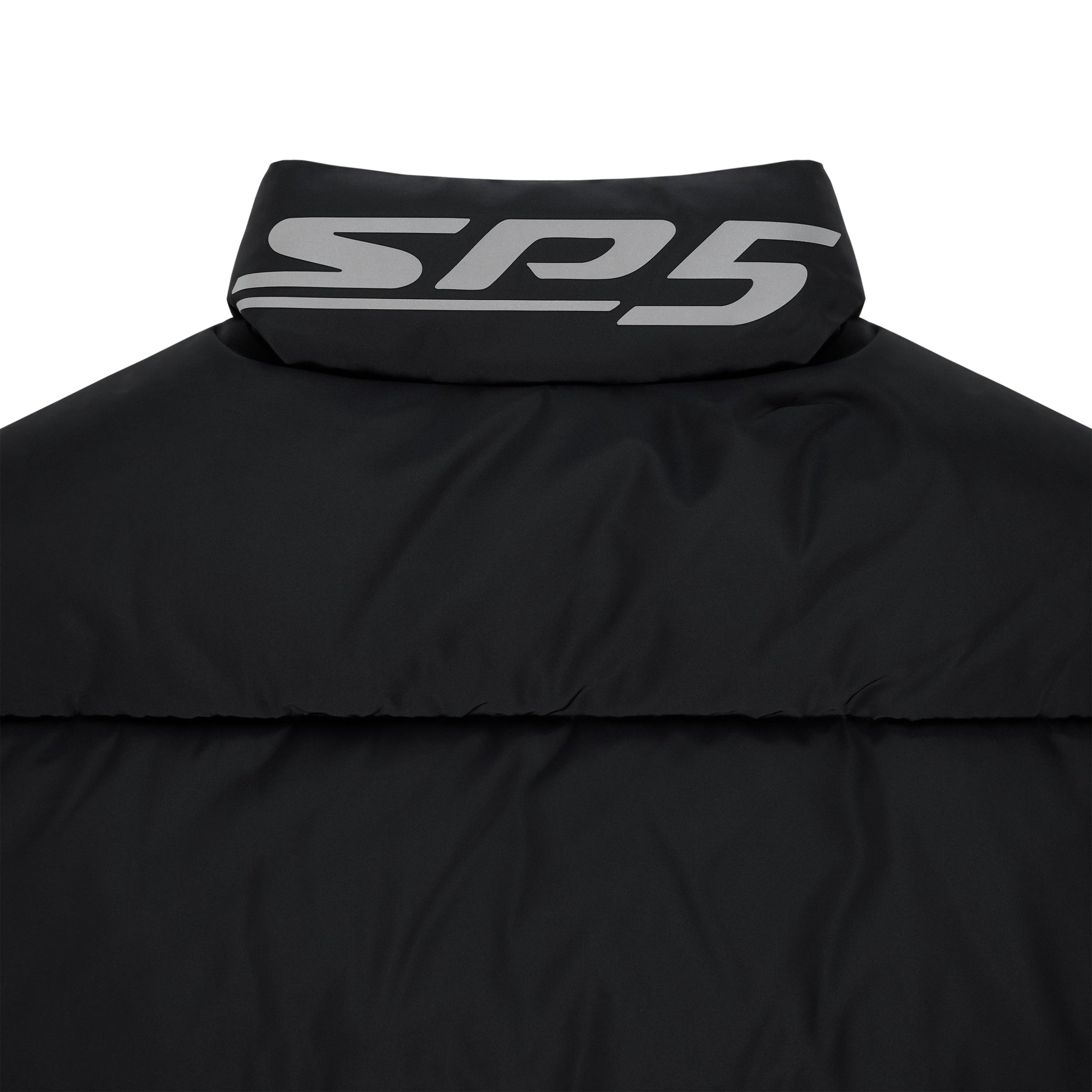 Detail view of internal drawstring hem on SP5DER Trackhawk Puffer Jacket in Black