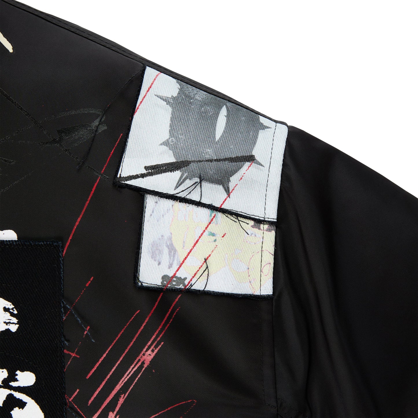Detail view of flap and welt pockets on SP5DER Vet Bomber Jacket in Black