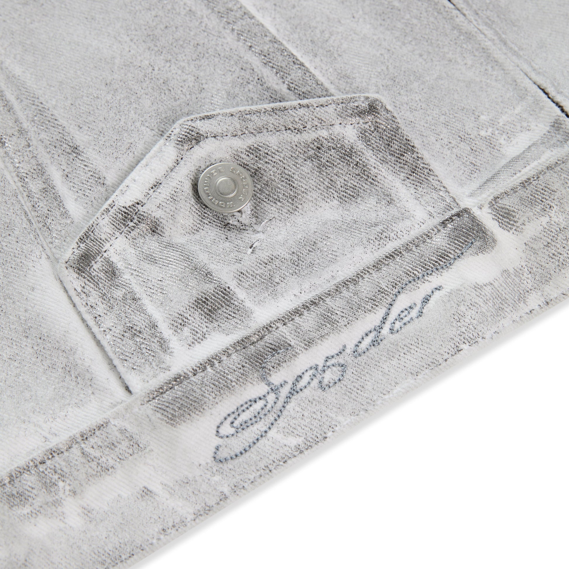 Detail view of chest pocket on SP5DER Platinum Trucker Jacket in Grey