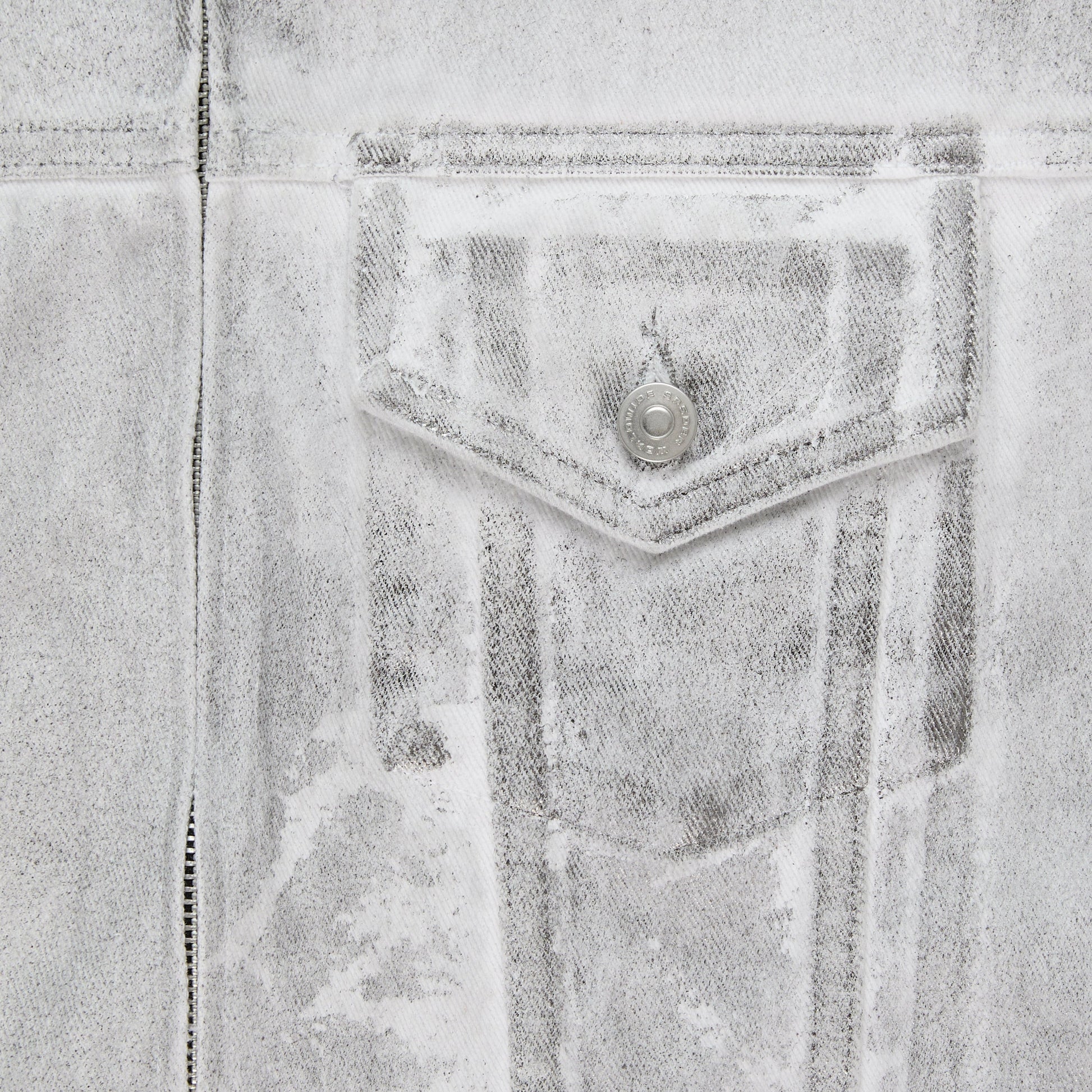 Detail view of hem pocket on SP5DER Platinum Trucker Jacket in Grey