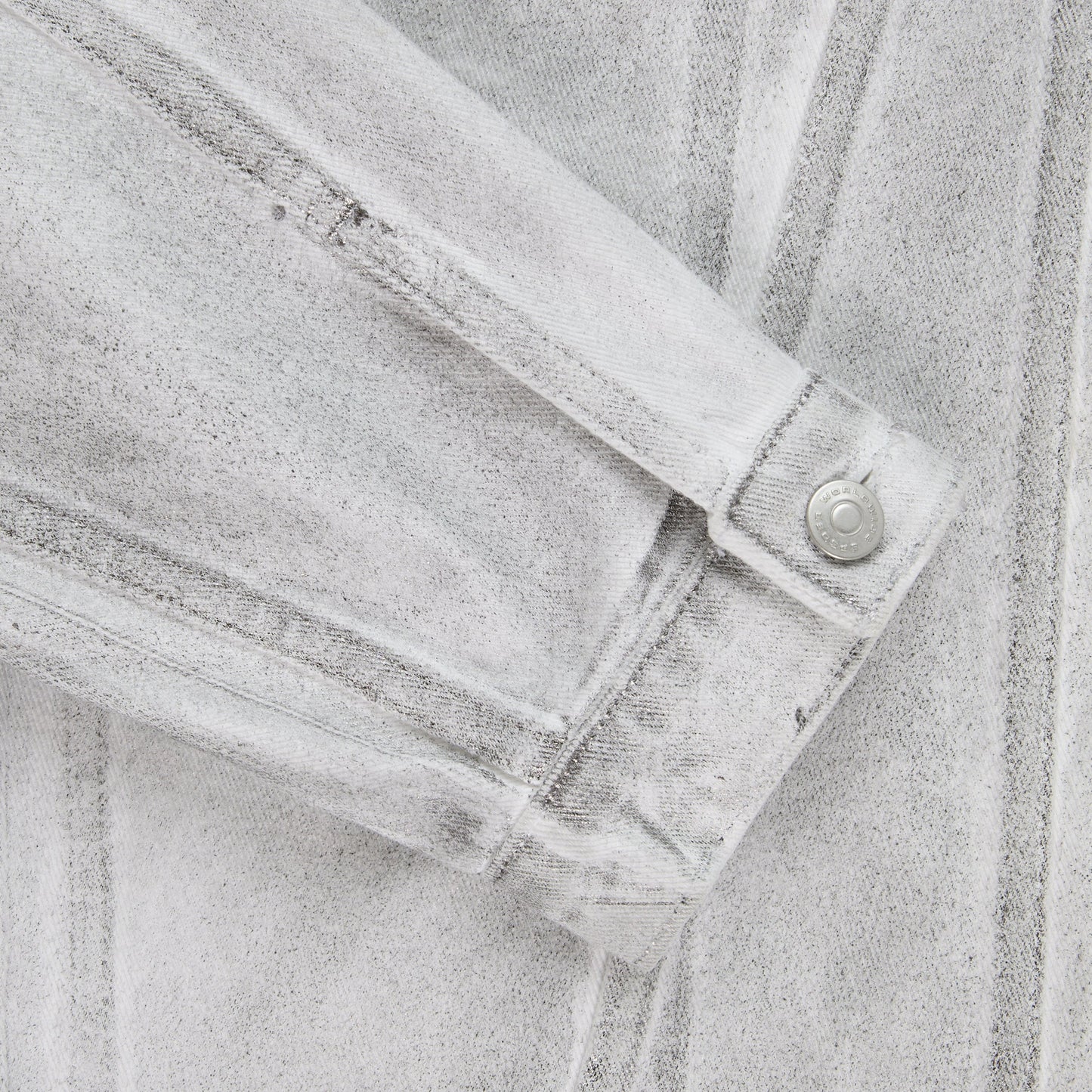Side view of SP5DER Platinum Trucker Jacket in Grey