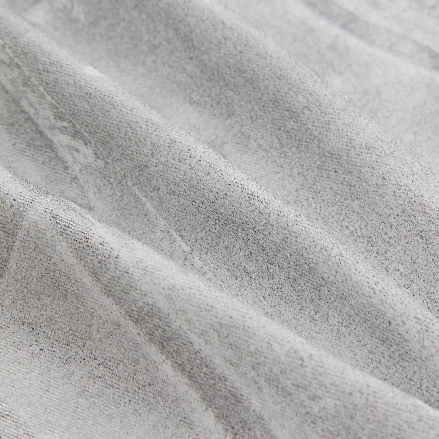 Detail view of embroidered logo on SP5DER Platinum Trucker Jacket in Grey