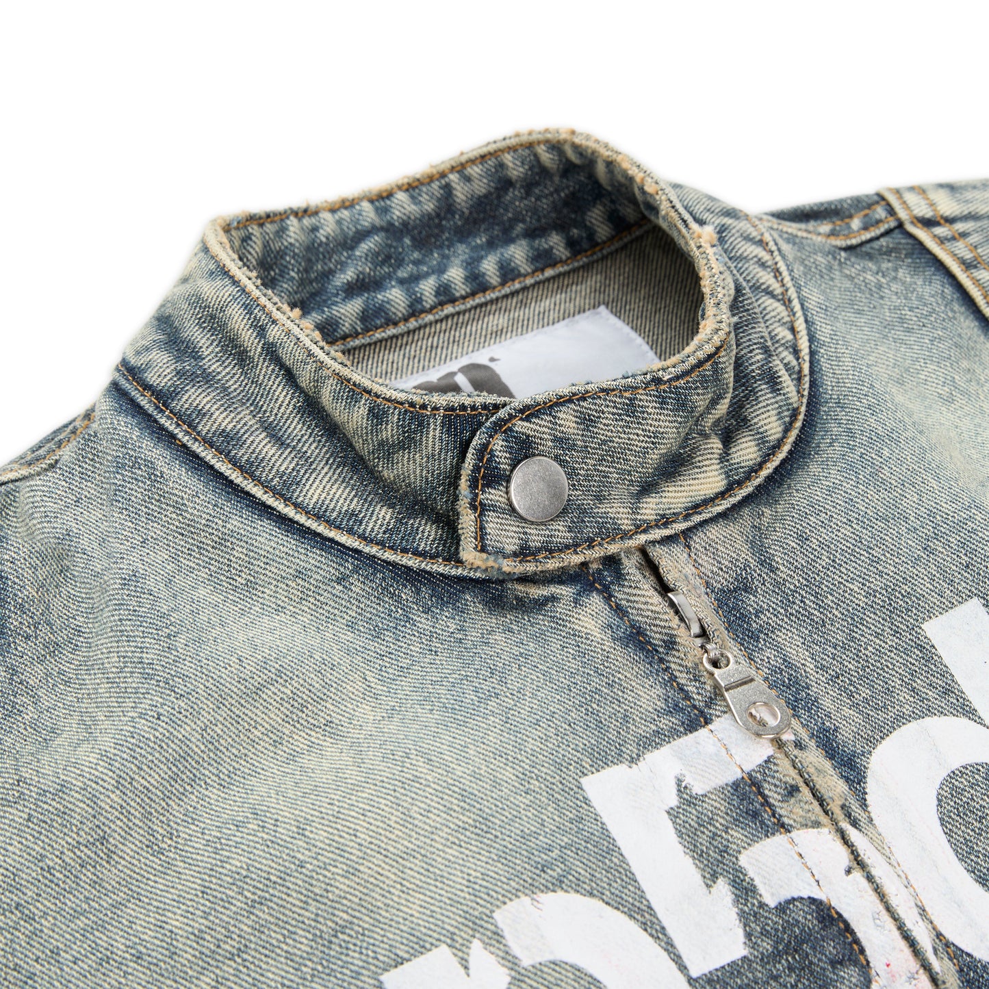 Detail view of star print on back of Motorsport Denim Jacket in Indigo