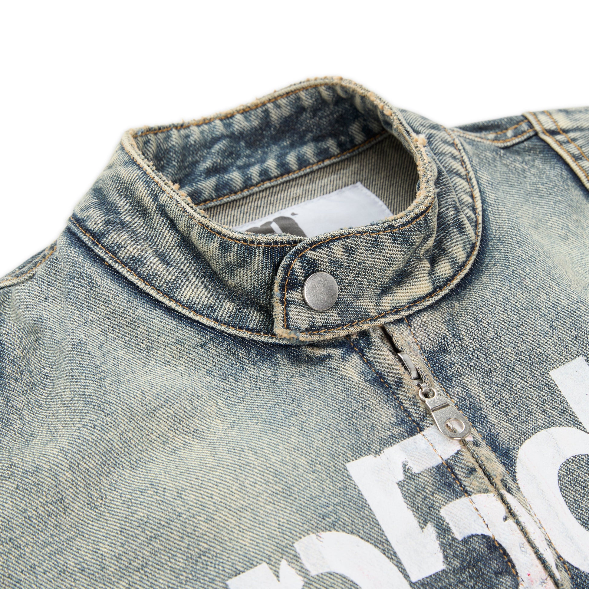 Detail view of star print on back of Motorsport Denim Jacket in Indigo