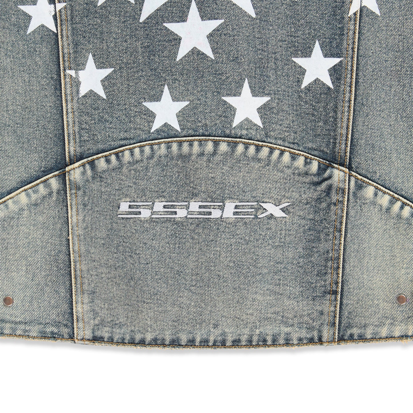 Detail view of sleeve cuff embroidery on Motorsport Denim Jacket in Indigo