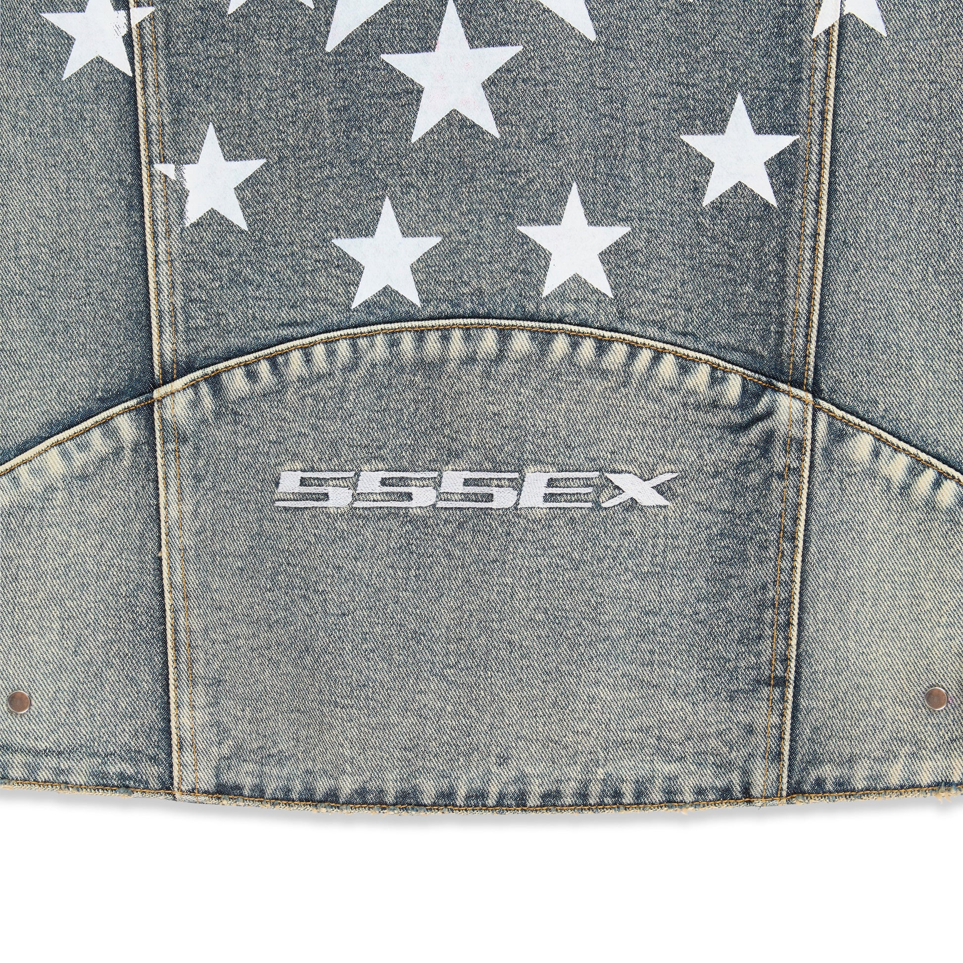 Detail view of sleeve cuff embroidery on Motorsport Denim Jacket in Indigo