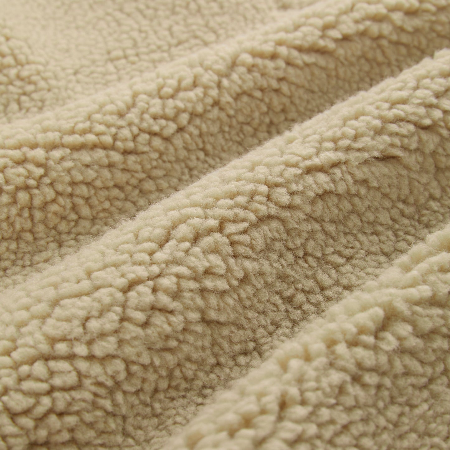 Detail view of welt pockets on SP5DER Teddy Fleece Zip-Up in Brown