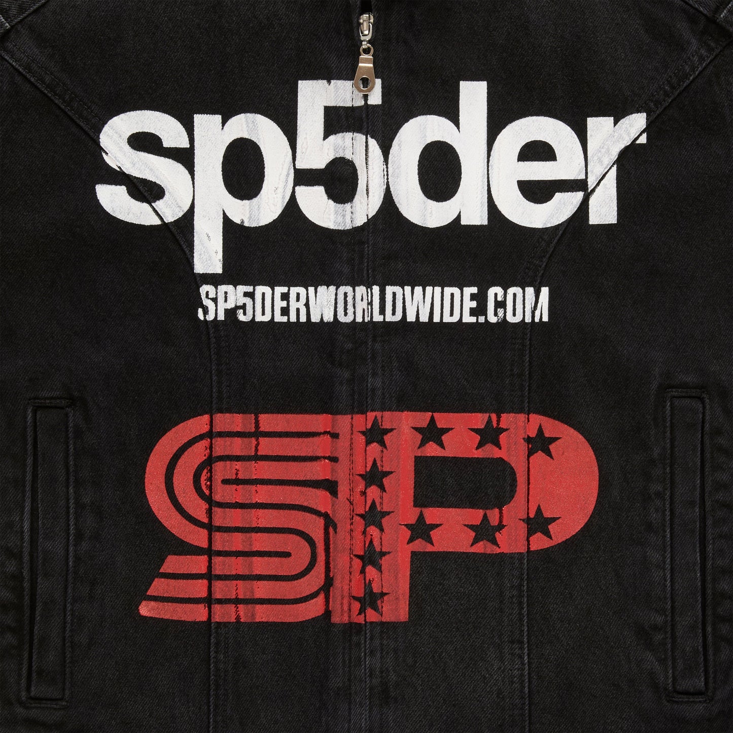 Detail view of SP5DER print on chest of Motorsport Denim Jacket in Black