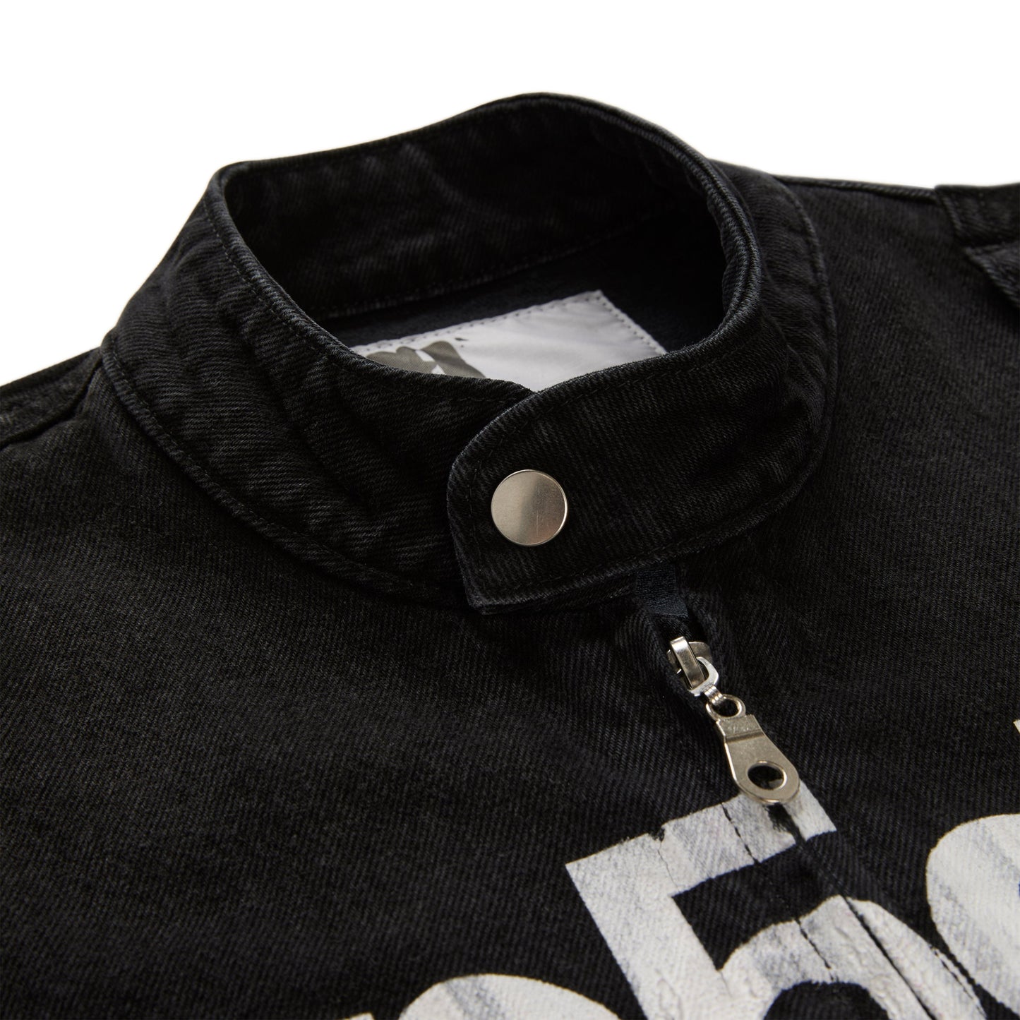 Detail view of star print on back of Motorsport Denim Jacket in Black
