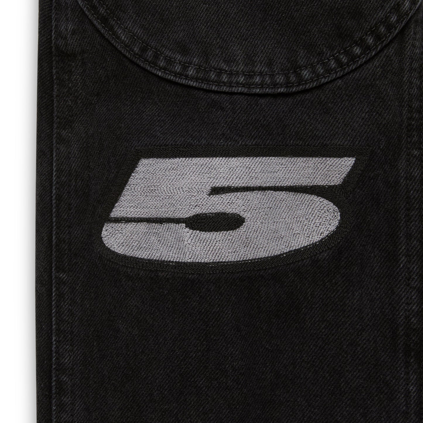 Detail view of sleeve cuff embroidery on Motorsport Denim Jacket in Black