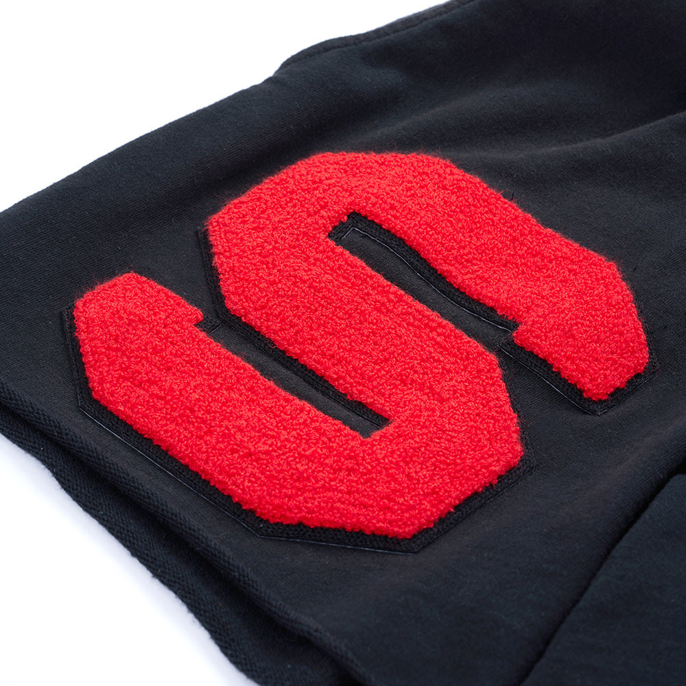 Detail view of sun-fade wash on SP5DER Cut Sweatshort in Black