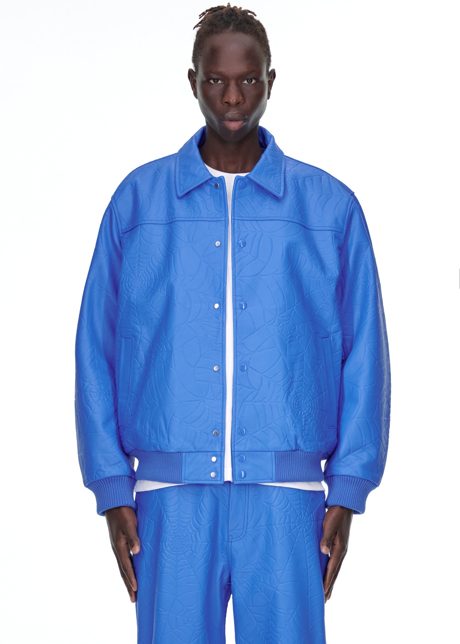 Additional angle view of SP5DER Debossed Web Leather Jacket in Blue