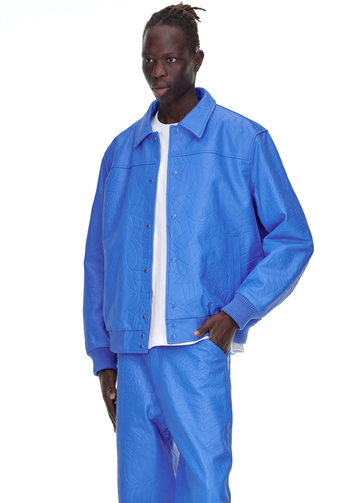 Close-up view of cuffs on SP5DER Debossed Web Leather Jacket in Blue