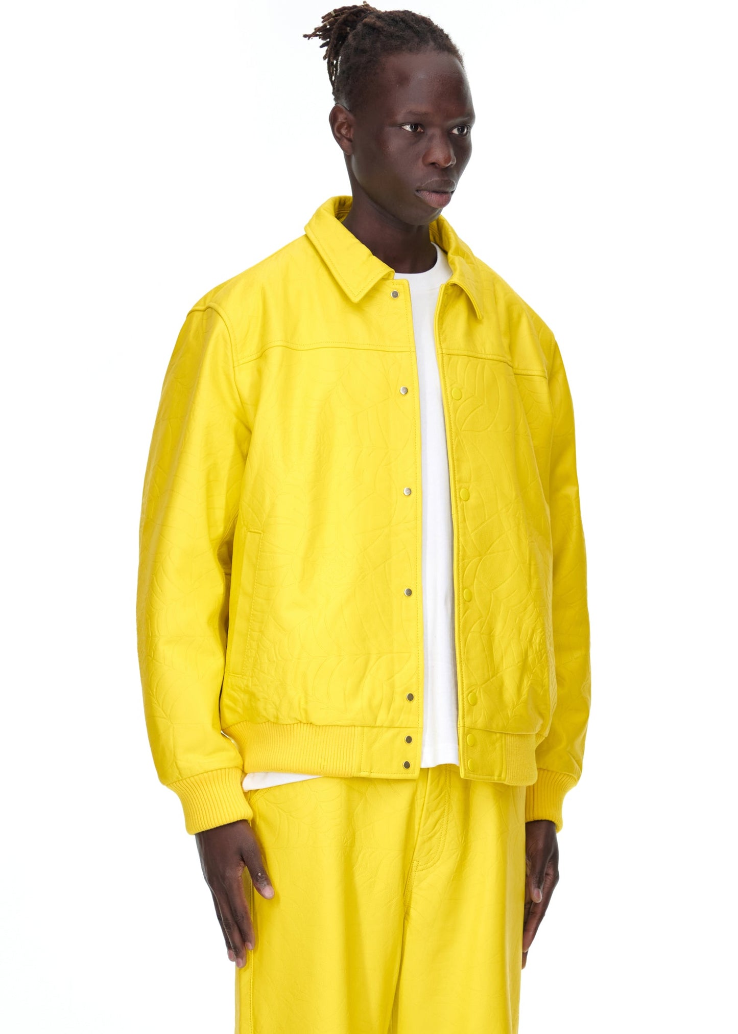 Close-up view of collar on SP5DER Debossed Web Leather Jacket in Yellow
