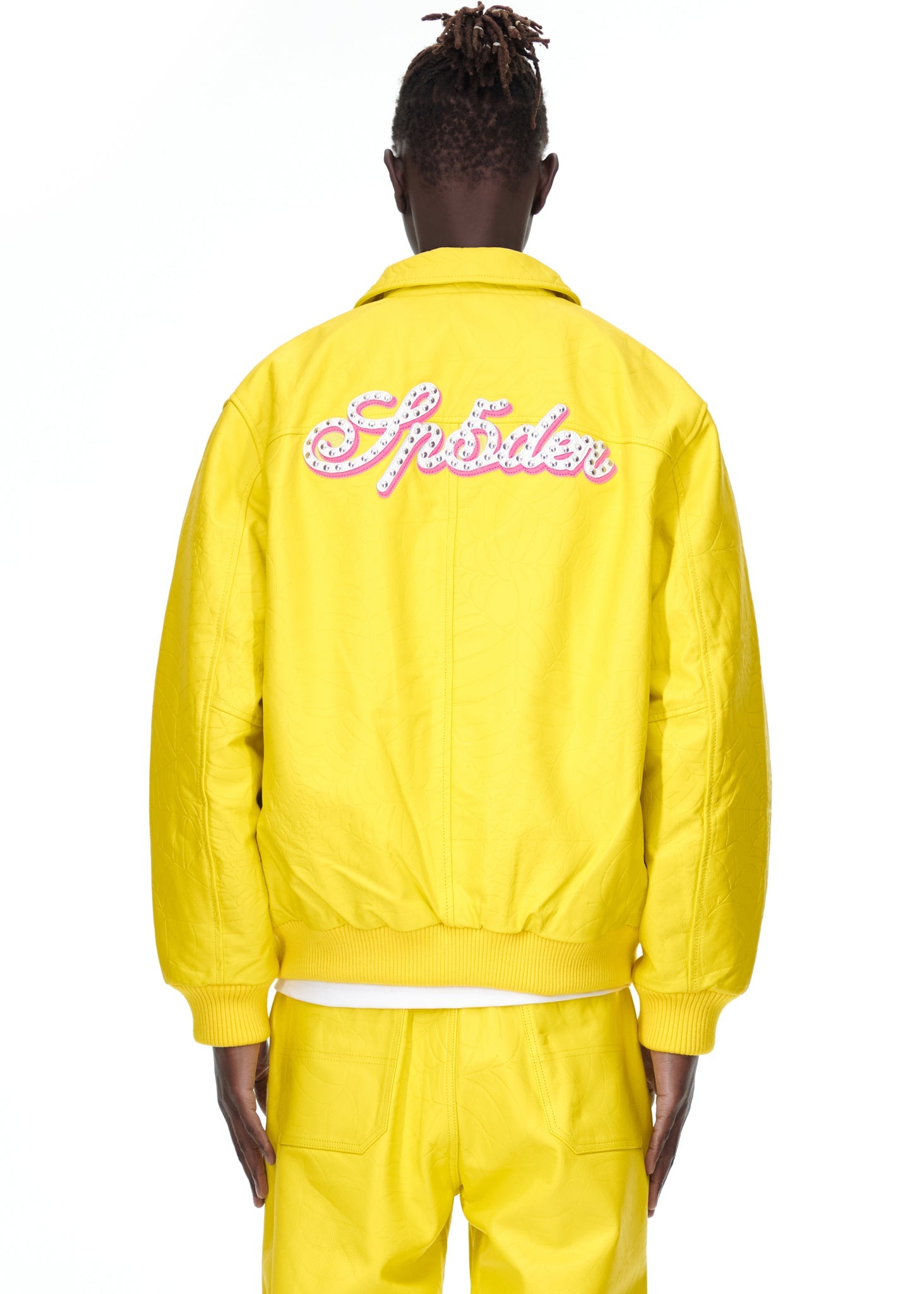 Side view of SP5DER Debossed Web Leather Jacket in Yellow