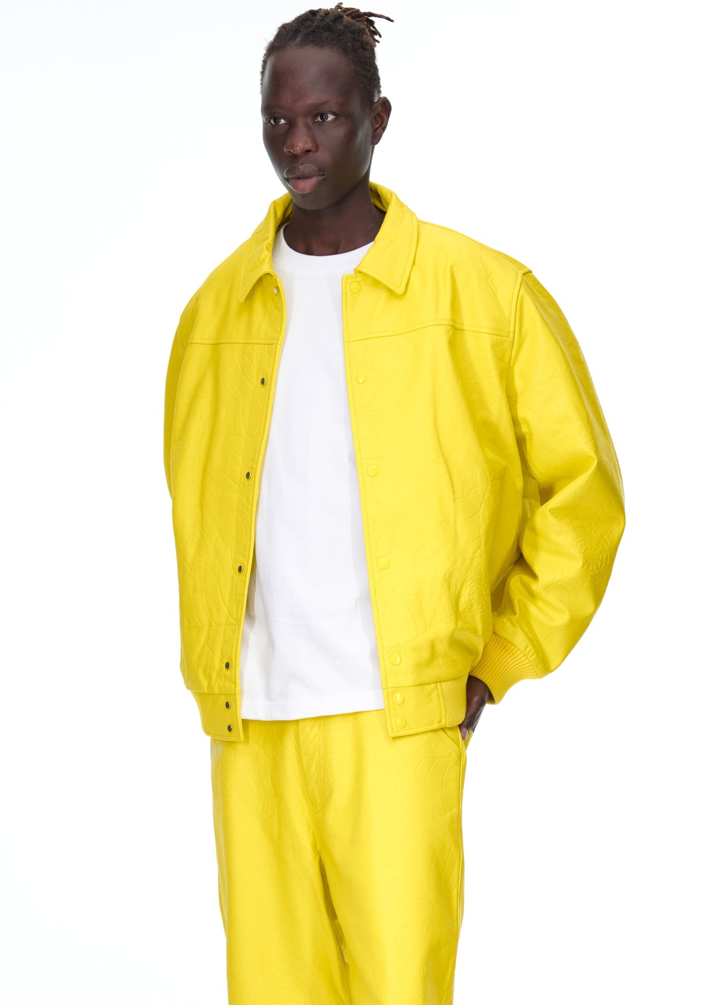 Close-up view of cuffs on SP5DER Debossed Web Leather Jacket in Yellow