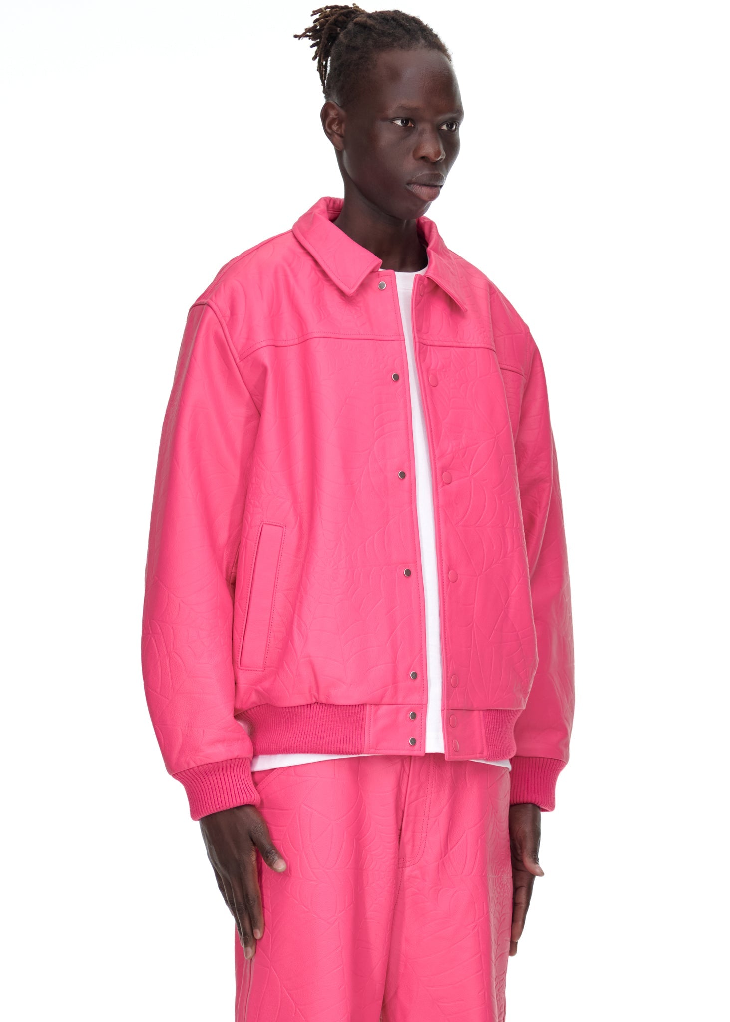 Side view of SP5DER Debossed Web Leather Jacket in Pink
