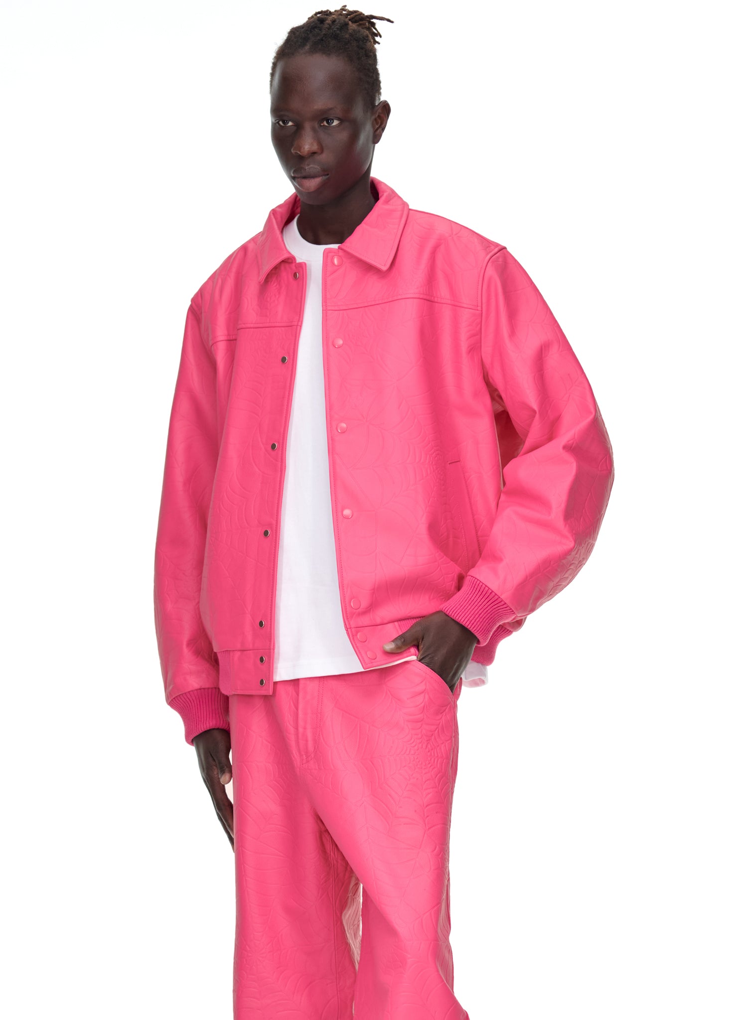 Close-up view of cuffs on SP5DER Debossed Web Leather Jacket in Pink